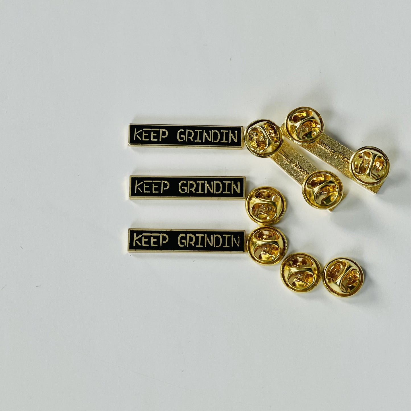 Épinglette Keep Grindin'