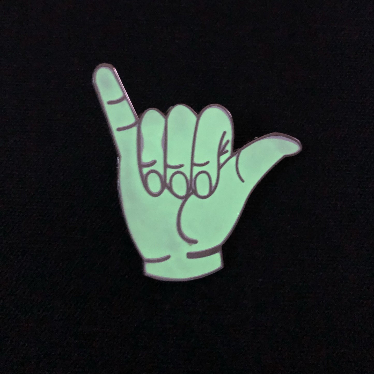 Épinglette Hang Ten qui brille dans le noir